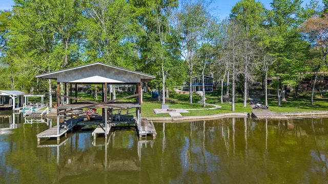view of dock with boat lift and a water view