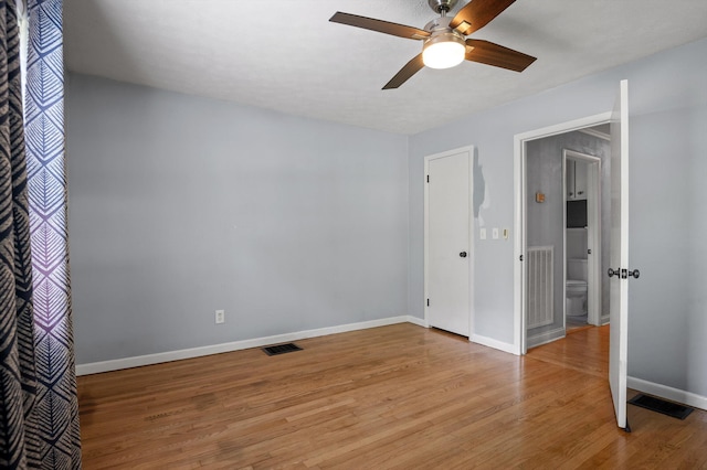 unfurnished bedroom featuring visible vents, light wood-style flooring, baseboards, and ceiling fan