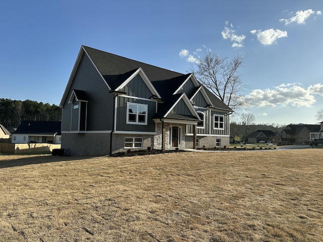 view of front of house featuring board and batten siding and stone siding