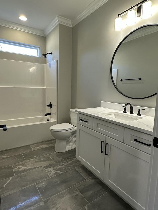 bathroom featuring toilet, vanity, crown molding, and washtub / shower combination