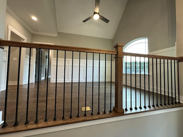 stairway with ceiling fan, ornamental molding, recessed lighting, wood finished floors, and high vaulted ceiling