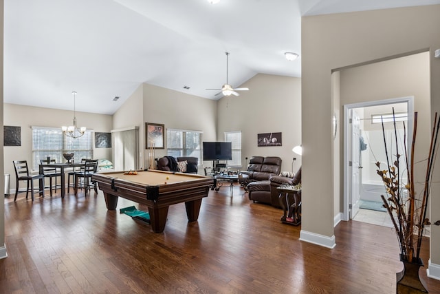 recreation room with ceiling fan with notable chandelier, high vaulted ceiling, dark wood-type flooring, and billiards