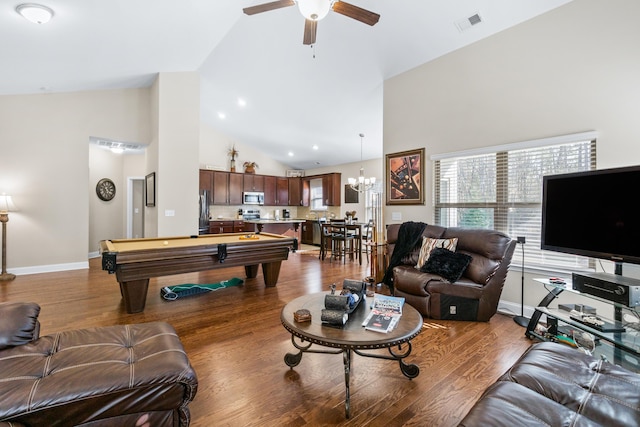 living room featuring visible vents, ceiling fan with notable chandelier, wood finished floors, high vaulted ceiling, and billiards