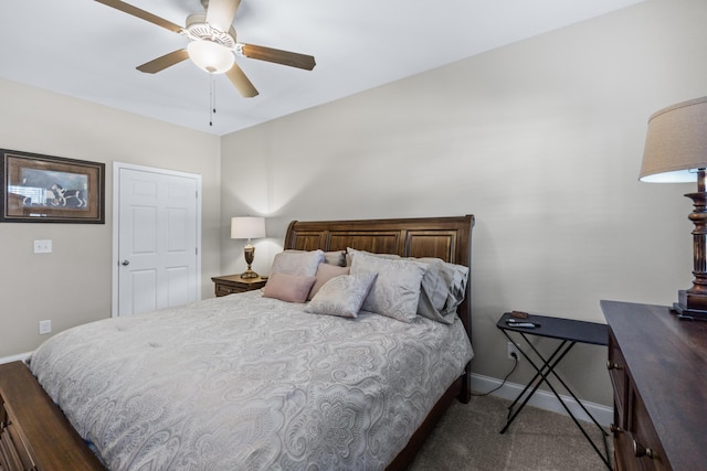 bedroom with a ceiling fan and baseboards