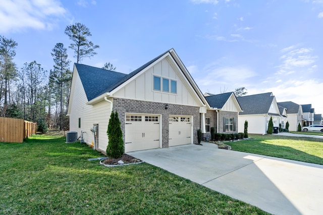 view of front of property featuring a front yard, central AC, board and batten siding, and driveway