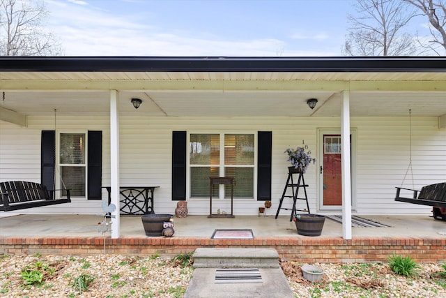 186 Joann Dr SE, Calhoun, GA 30701 - view of exterior entry featuring a porch