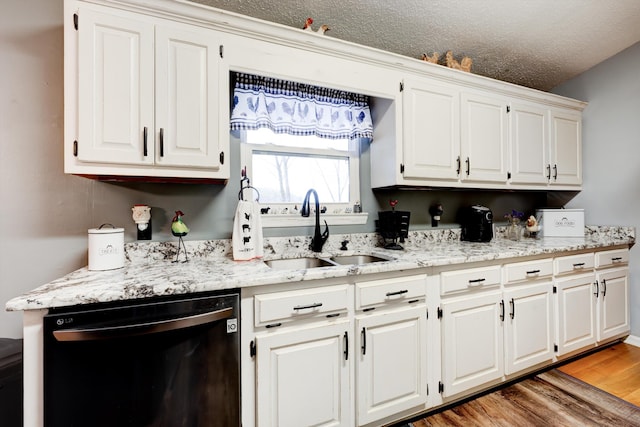 186 Joann Dr SE, Calhoun, GA 30701 - kitchen with dishwashing machine, light wood finished floors, a sink, white cabinets, and a textured ceiling