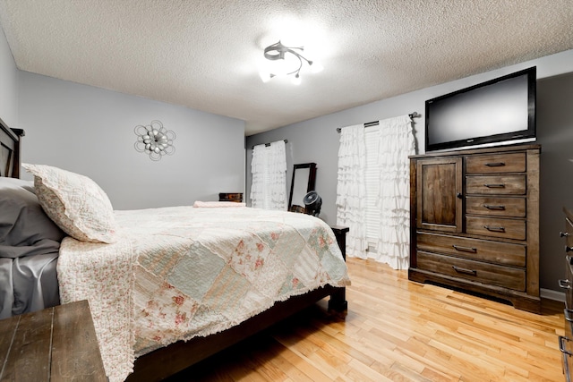 186 Joann Dr SE, Calhoun, GA 30701 - bedroom with a textured ceiling and light wood-type flooring