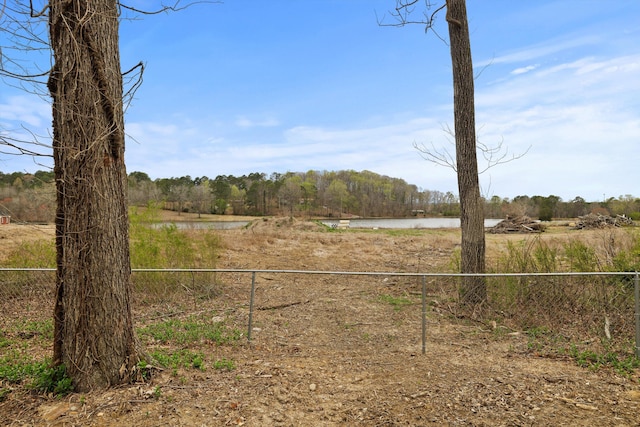 186 Joann Dr SE, Calhoun, GA 30701 - view of yard featuring a wooded view, a water view, and fence
