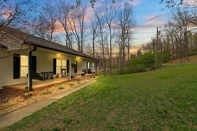 186 Joann Dr SE, Calhoun, GA 30701 - yard at dusk featuring a porch