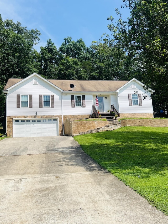 12811 Thatch Rd, Harrison, TN 37341 - ranch-style house featuring driveway, an attached garage, and a front yard