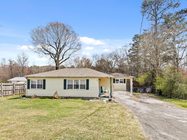 single story home with a front yard, driveway, and fence