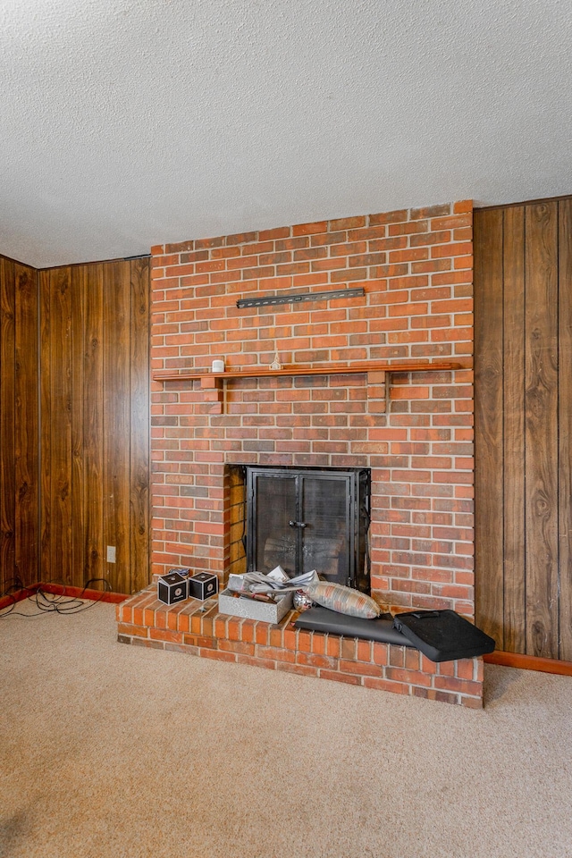2011 Robbins St, Chattanooga, TN 37404 - interior details with carpet, a brick fireplace, wood walls, and a textured ceiling