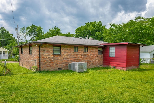 2011 Robbins St, Chattanooga, TN 37404 - rear view of house featuring a lawn, crawl space, fence, and central AC unit