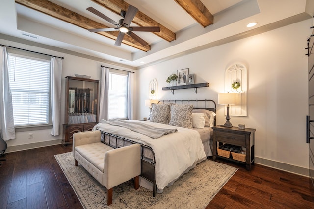 bedroom featuring visible vents, baseboards, and hardwood / wood-style floors