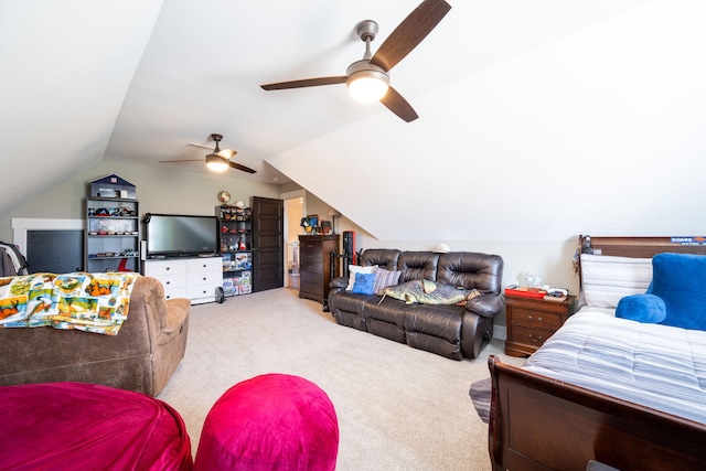 carpeted bedroom with vaulted ceiling and ceiling fan