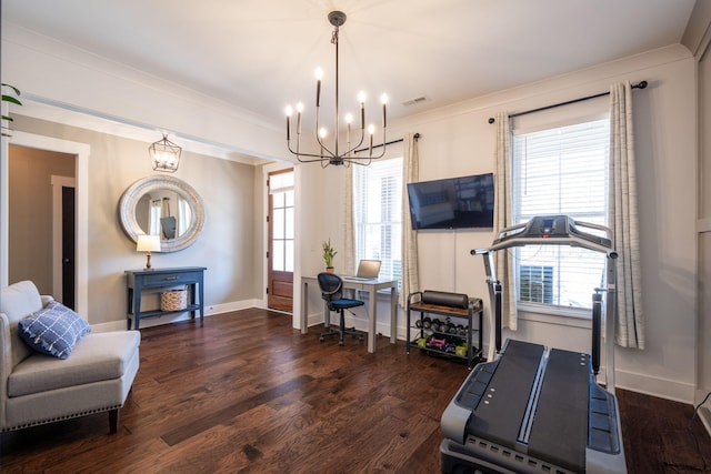 interior space with a notable chandelier, a healthy amount of sunlight, and wood finished floors