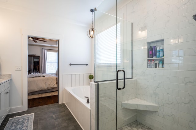full bath with a shower stall, ceiling fan, ensuite bathroom, a bath, and vanity