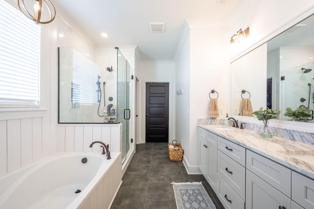 full bathroom featuring ornamental molding, a shower stall, baseboards, a bath, and vanity