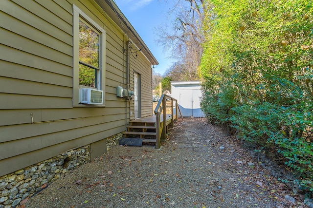 209 Tremont St, Chattanooga, TN 37405 - view of side of home featuring cooling unit, a wooden deck, and an outdoor structure