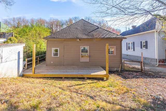 209 Tremont St, Chattanooga, TN 37405 - back of house with a shingled roof, a wooden deck, and fence