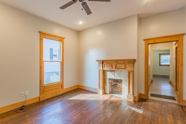 209 Tremont St, Chattanooga, TN 37405 - unfurnished living room featuring hardwood / wood-style floors, baseboards, visible vents, a fireplace, and ceiling fan