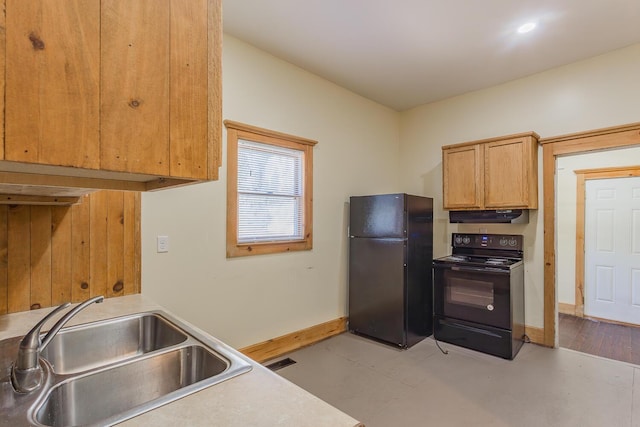 209 Tremont St, Chattanooga, TN 37405 - kitchen featuring visible vents, baseboards, under cabinet range hood, black appliances, and a sink