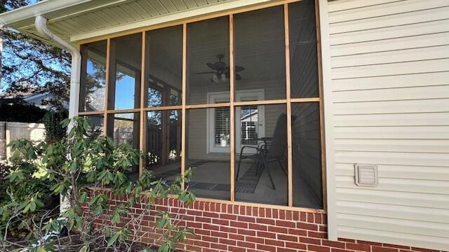 view of property exterior featuring a sunroom