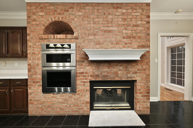 interior space featuring crown molding, dark brown cabinetry, and double oven