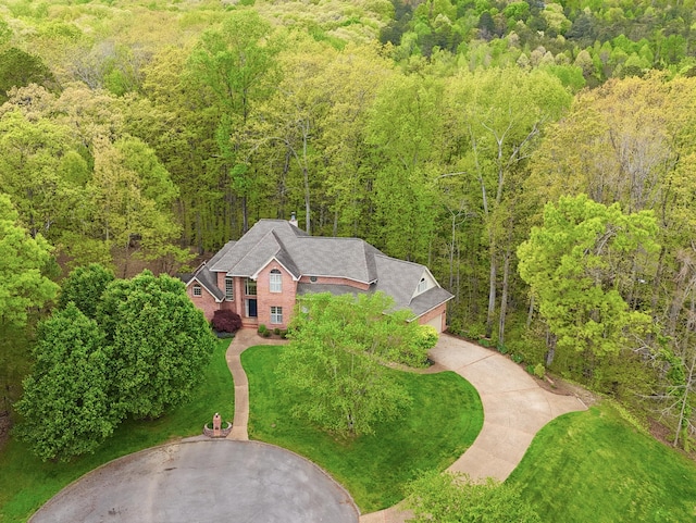 aerial view featuring a wooded view