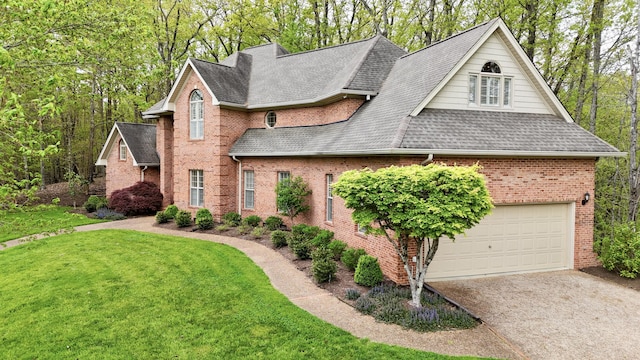 view of front of house featuring an attached garage, brick siding, a front lawn, driveway, and roof with shingles