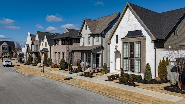 view of front facade with a residential view and a standing seam roof