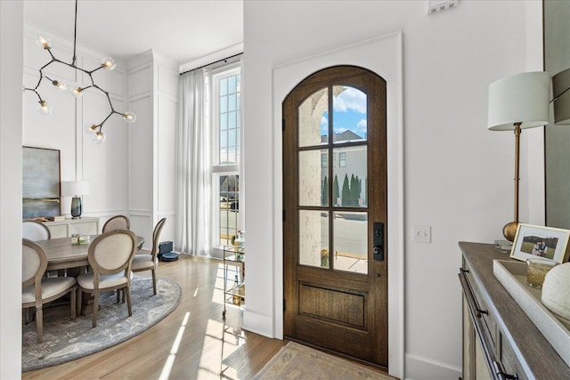 foyer featuring wood finished floors
