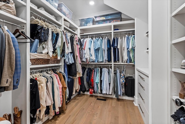walk in closet featuring light wood finished floors