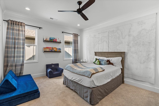 bedroom with crown molding, multiple windows, visible vents, and carpet floors
