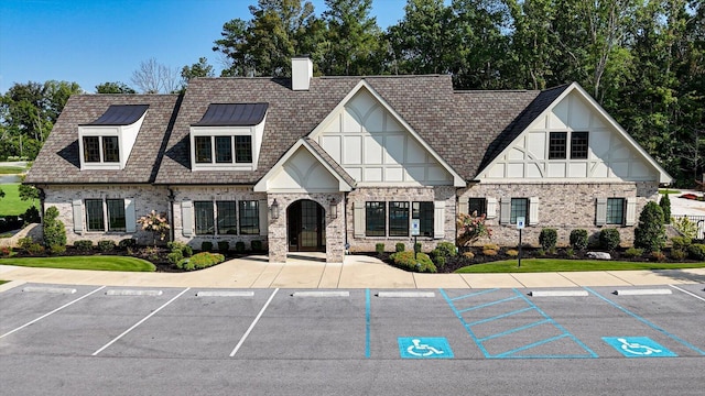 view of building exterior featuring uncovered parking