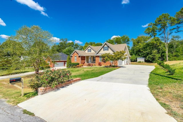 view of front of house with an attached garage, concrete driveway, and a front yard