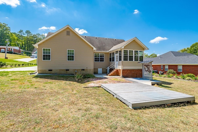 back of house with crawl space, a lawn, entry steps, and a sunroom