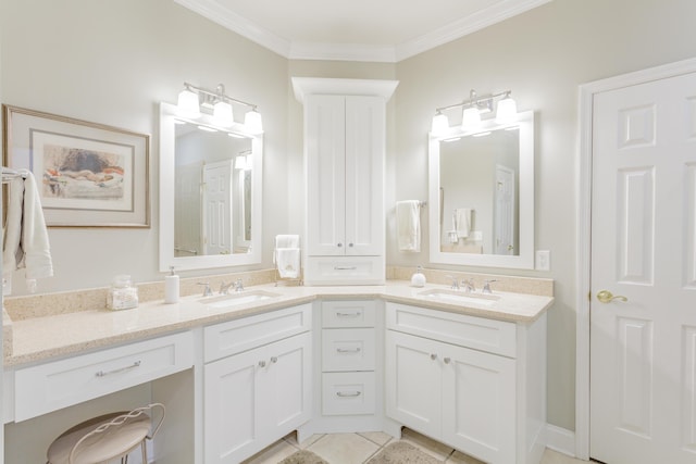 full bath featuring crown molding, double vanity, and a sink