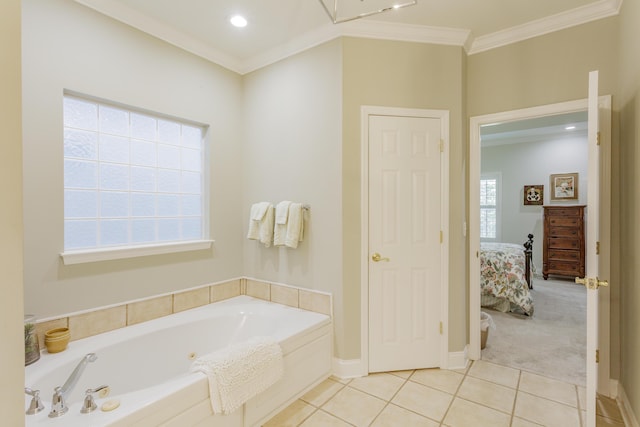 ensuite bathroom with ensuite bathroom, ornamental molding, tile patterned flooring, and a tub with jets