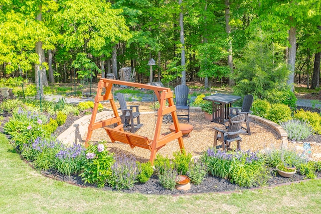 view of play area featuring an outdoor fire pit