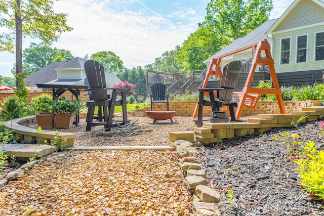 view of playground with a patio area
