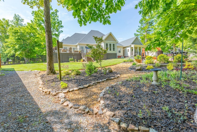 view of yard featuring stairs and a wooden deck
