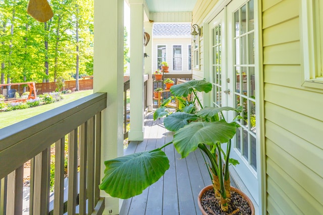 balcony with french doors and a porch