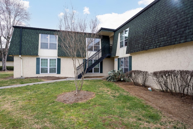 900 Mountain Creek Rd # 363, Chattanooga, TN 37405 - rear view of house with stairway, mansard roof, a yard, and stucco siding