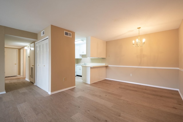 900 Mountain Creek Rd # 363, Chattanooga, TN 37405 - interior space with light wood finished floors, visible vents, and a chandelier