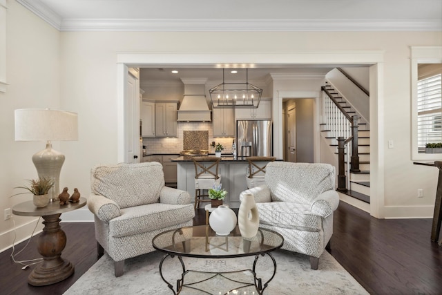 living area featuring baseboards, an inviting chandelier, stairs, dark wood-type flooring, and crown molding