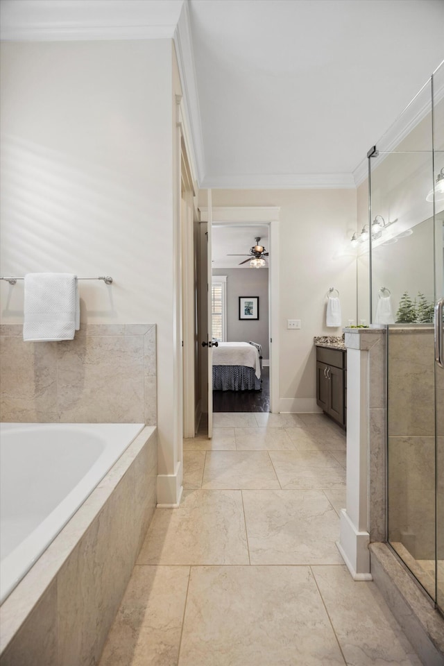 bathroom with a garden tub, a stall shower, ornamental molding, ensuite bath, and vanity