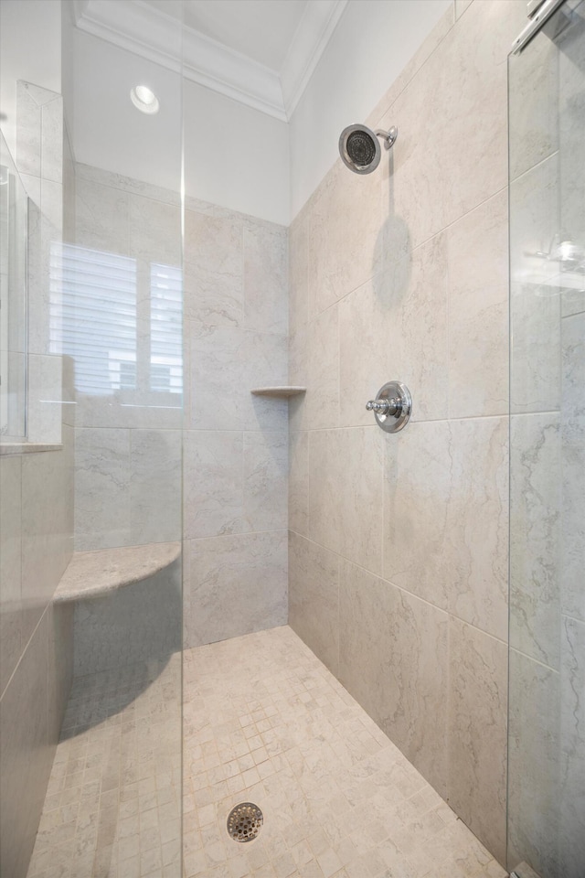 full bathroom featuring crown molding and walk in shower