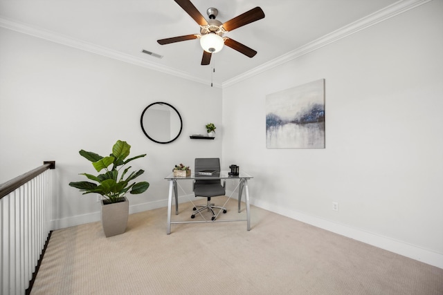 home office featuring a ceiling fan, baseboards, carpet, and crown molding
